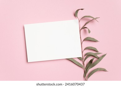 Blank greeting or invitation card mockup with copy space for card design on pink background, copy space