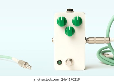 Blank guitar pedal with green knobs and jacks