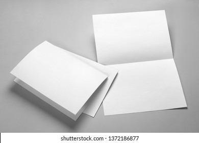 Blank Half-folded Booklet, Postcard, Flyer Or Brochure Mockup Template On Gray Background