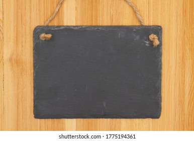 Blank Hanging Chalkboard Sign On Wood With Copy Space For Your Message