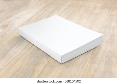 Blank hard cover book template on wood.