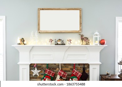 Blank horizontal 20x35 wood sign haning on wall over fireplace with holiday decor, christmas frame mockup