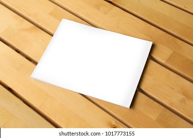 Blank Horizontal Book On Wooden Warm Table For Mockup.