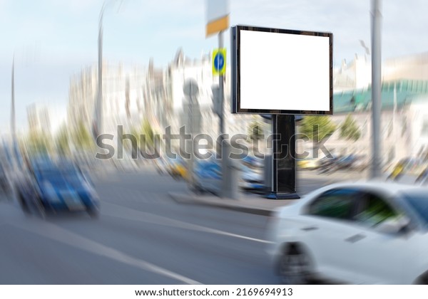 Blank horizontal large billboard\
in the city. Wide highway, lots of cars. Rotation blur.\
Mock-up.