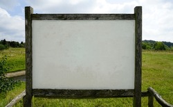 Blank black granite board outdoors. Mockup of a memorial or nominal ...