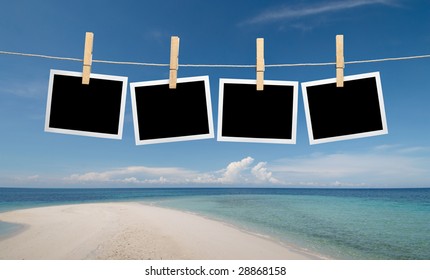 Blank Instant Photos Hanging On Clothesline At The Beach