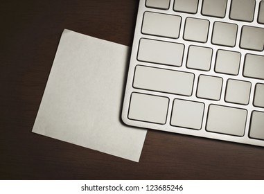 blank keyboard and notepad on table
