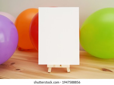 Blank Kids Party Invitation On Small Wooden Easel, Happy Birthday Card Mockup, Colorful Balloons, Celebration.
