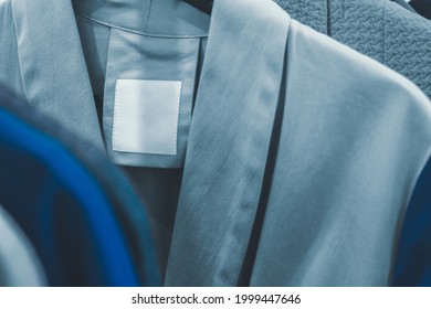 Blank Label Inside A Blue Jacket. Place For Brand And Logo Presentation