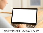 Blank laptop screen being used by woman at home
