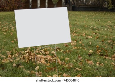 Blank lawn sign in park