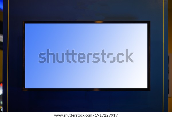 Blank lcd smart TV presentation at event
convention exhibit trade show and booth in conference hall, white
Mock up blank advertising on blue
background