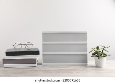 Blank Letter Board, Books, Glasses And Beautiful Houseplant On Wooden Table. Mockup For Design