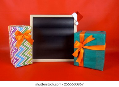 Blank Letterboard with Santa Hat And Gifts for Customizable Holiday Messages - Powered by Shutterstock