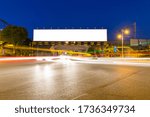 blank light box billboards at railway bridge with light trails on city road, clipping path