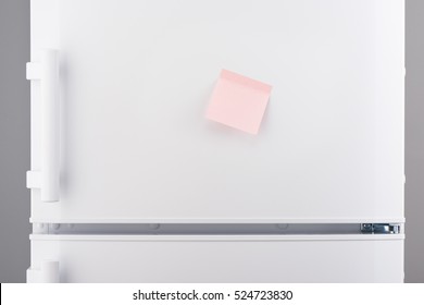 Blank Light Pink Sticky Paper Note On White Refrigerator Door