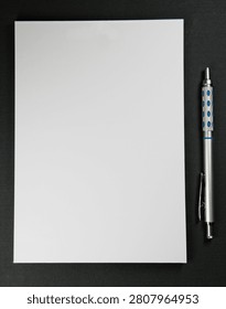 Blank Lined Notepad with Mechanical Pencil on Dark Background