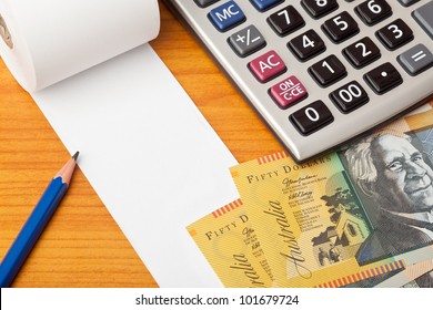 Blank List With Australian Money,calculator And Pencil On A Table