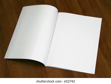 Blank Magazine Spread On A Wooden Table (Insert Your Own Design Or Content). Could Also Be Used As A Test, Contract And Etc.