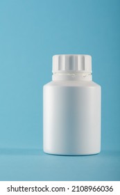 Blank Medicine Bottle On Blue Background