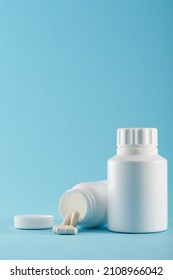 Blank Medicine Bottle On Blue Background