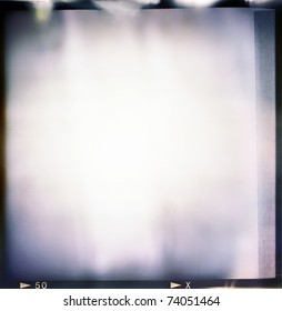 Blank Medium Format (6x6) Color Film Frame With Abstract Filling With Lot Of Light Leaks, Last Exposure Ending With Tape, Hard Vintage Film Grain Effect Added; Kind Of A Background