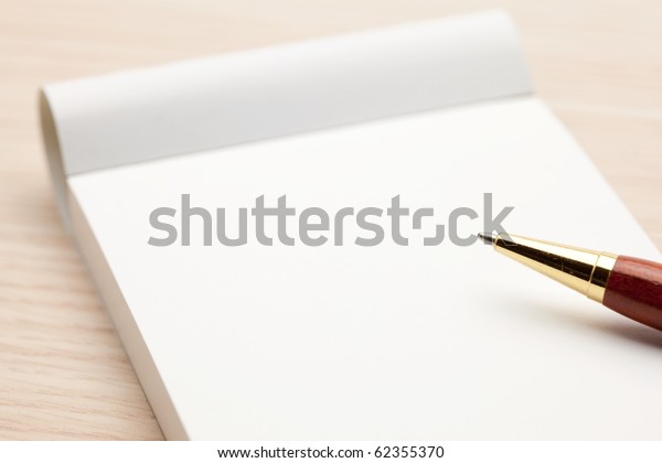 Blank memo pad isolated on\
white.