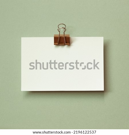 Blank memo pad on green background. copy space
