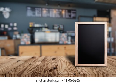 Blank Menu Board On Wooden Top Table With Blurred Of Coffee Shop Background