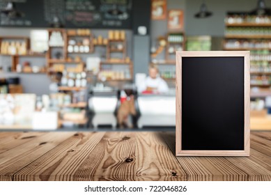 Blank Menu Board On Wooden Top Table With Blurred Of Coffee Shop Background