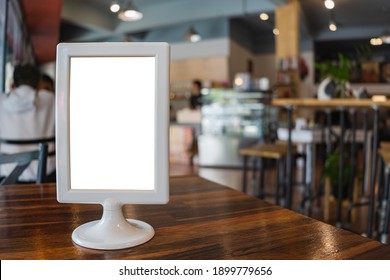 Blank Menu Frame Put On Wooden Table In Cafe Or Restaurant. 