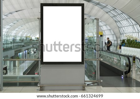 Blank mock up of vertical street poster billboard on Airport Background with plane passengers.