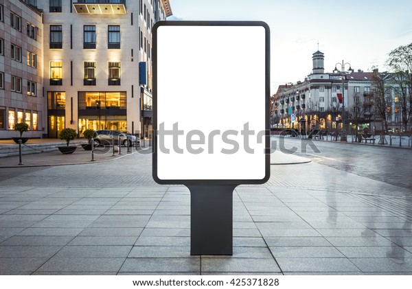 Blank mock up of vertical street poster\
billboard on city\
background