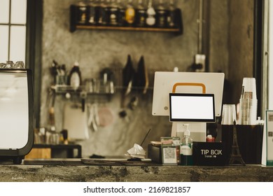 Blank Mockup Cash Desk With White Screen In Coffee Shop, Vintage Theme Effect.