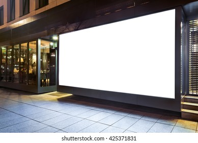 Blank Mockup Of Store Street Showcase Advertising Poster Window In A City At Night