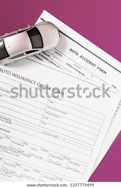 blank motor\
insurance document with toy car\
model