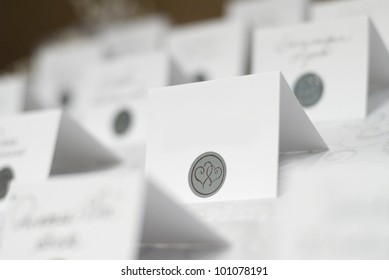 Blank Name Tags On A Table, Closeup, Only One Is Sharp