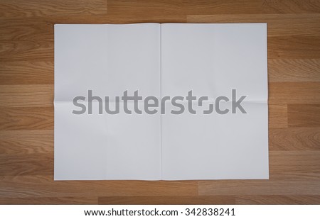 Blank Newspaper with empty space mock up on wood background