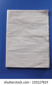 Blank Newspaper On The Blue Background