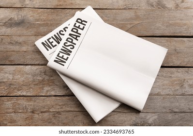 Blank newspapers on wooden background