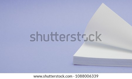 Blank note papers label with clip on purple background