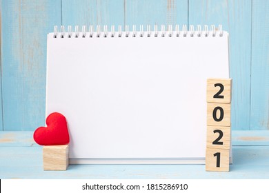 Blank Notebook And 2021 Cubes With Red Heart Shape Decoration On Blue Wooden Table Background. New Year NewYou, Goal, Resolution, Health, Love And Happy Valentine’s Day Concept