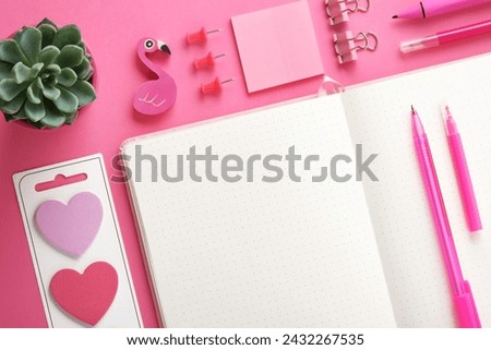 Blank notebook page for your text with pink school and office stationery on magenta background. Flatly.