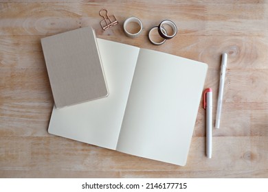 Blank notebook and pen on office wood table background. Business concept with copy space for any design