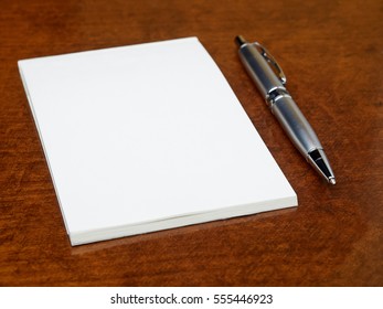 Blank Notebook And Pen On The Table