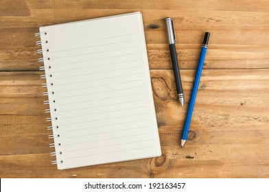 Blank Notebook With Pen And Pencil On Wooden Table, Business Concept