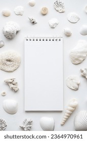 Blank notebook surrounded sea shells. Summer memories concepts. - Shutterstock ID 2364970961