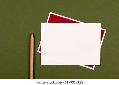 Blank Notecard And Pencil On Green Background