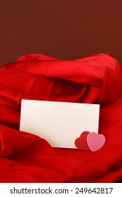 A blank notecard placed within a romantic scene.