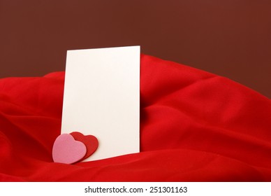 A blank notecard placed within a romantic scene.